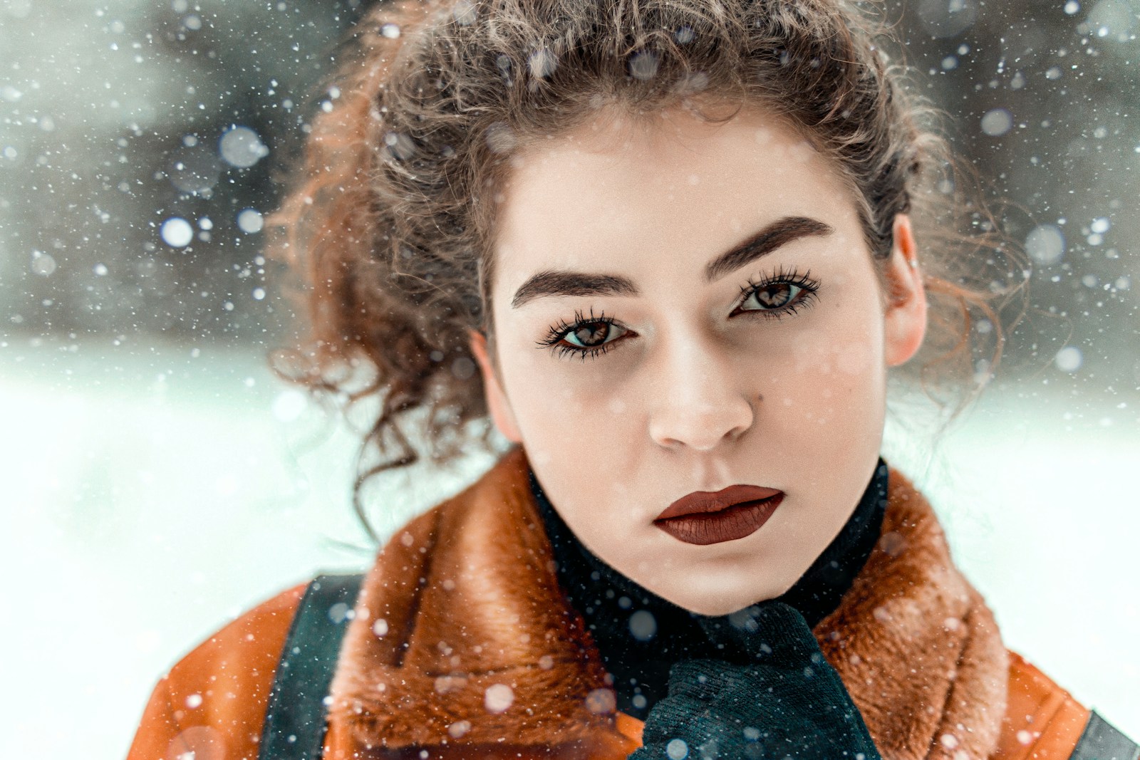 woman in brown and black fur coat